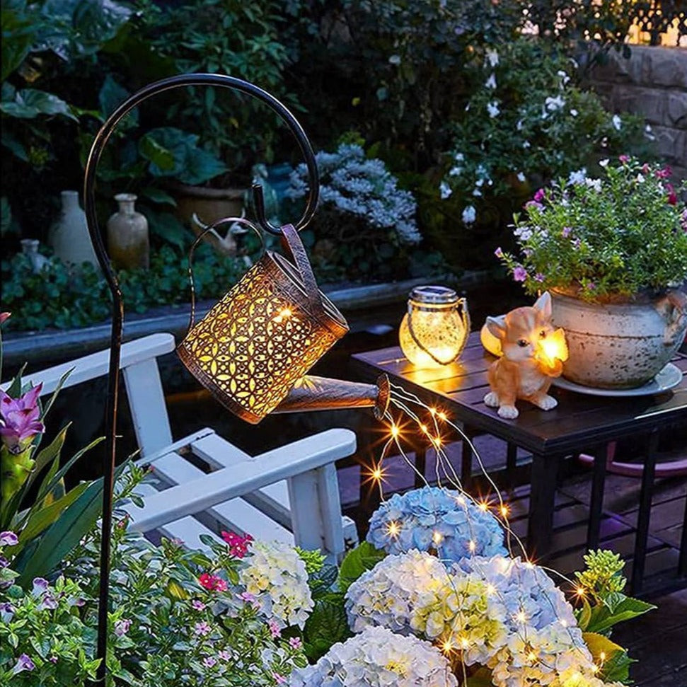 Weather-resistant solar LED watering can lantern, perfect for patio & garden lighting, a unique yard decoration.