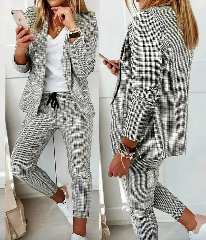 Stylish women's two-piece business suit set. Modern professional workwear for a confident career look.