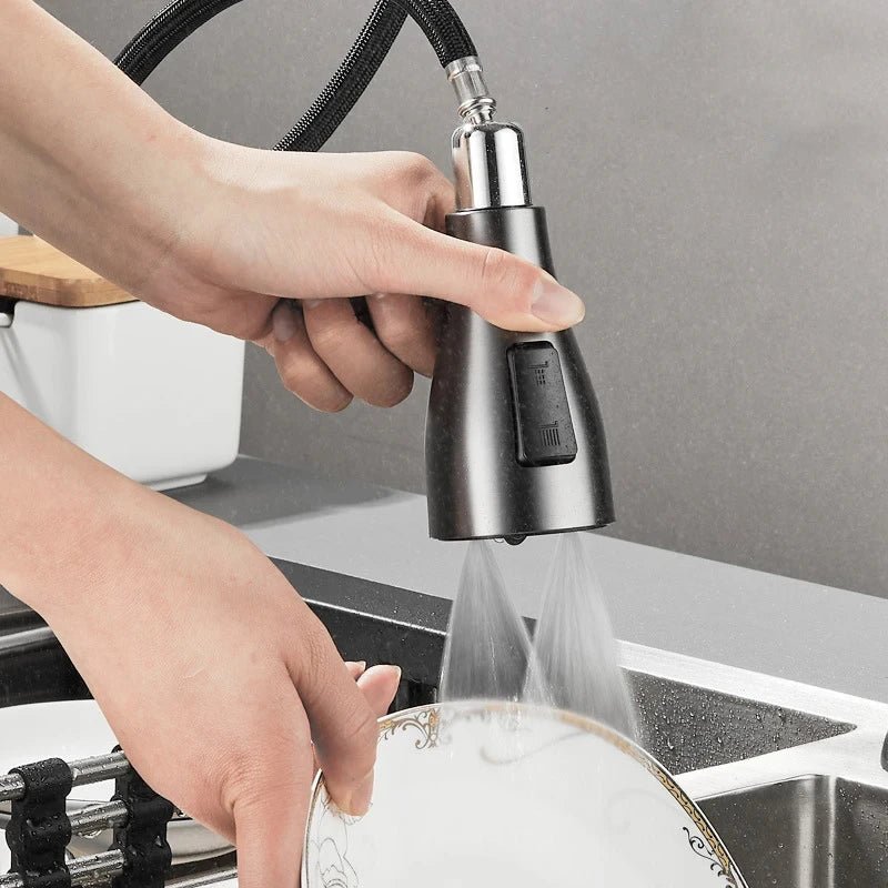 Stainless steel modern kitchen faucet, deck-mounted with pull-out sprayer and 360° swivel.