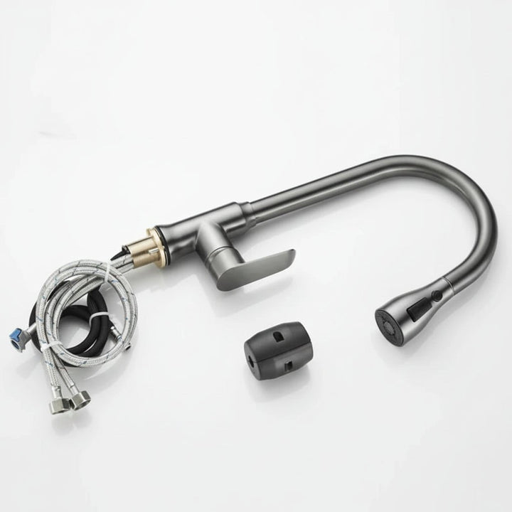Home kitchen faucet in use, showing the pull-out spray extended for versatile washing tasks.