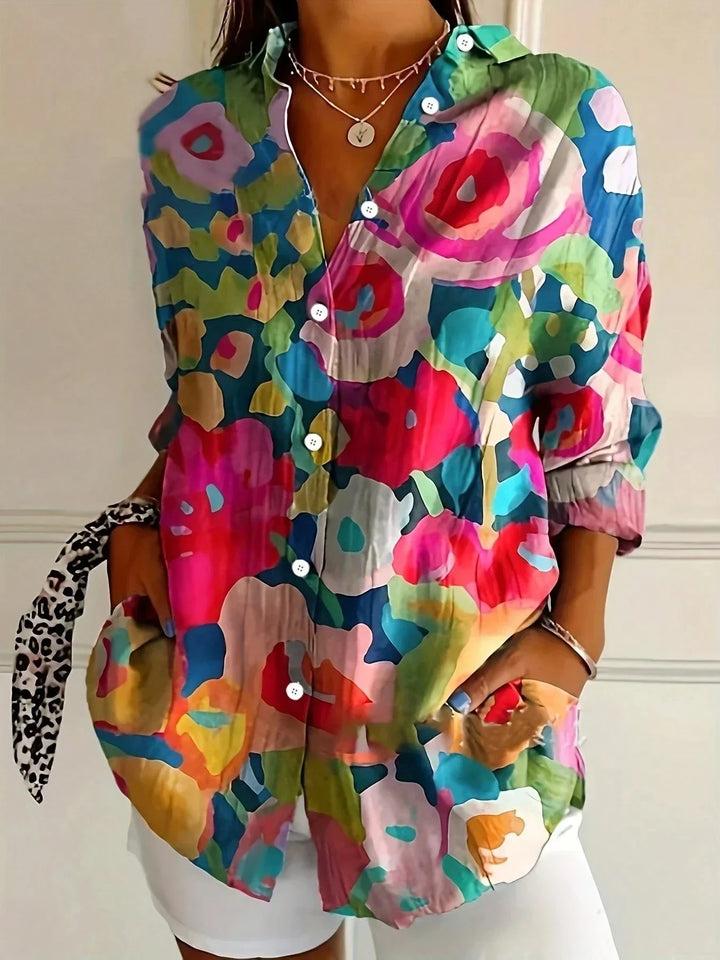 Stylish women's abstract print long sleeve blouse with button-front. Versatile shirt for various occasions.