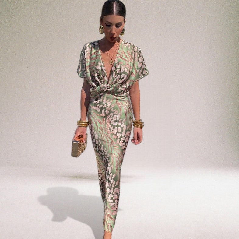 Elegant women's wrap maxi dress, perfect for wedding guests or formal occasions. Features a flattering V-neck.