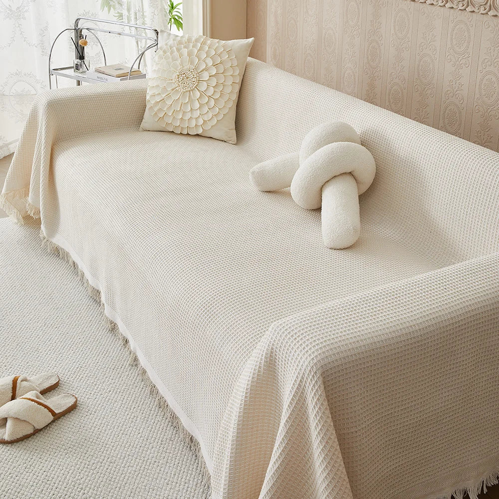 Beige cotton woven sofa cover for living room, a washable furniture protector for sectional sofas. Soft home decor.
