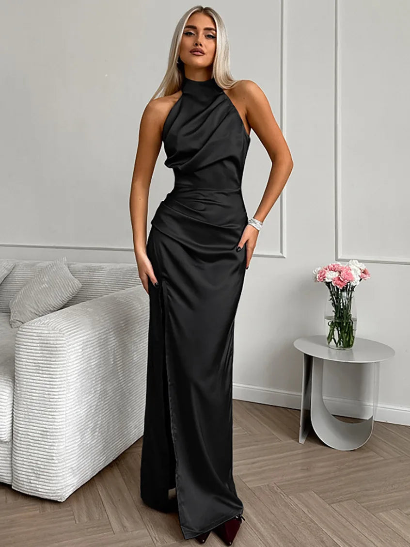 Sleeveless women's halter-neck maxi dress with a flowing silhouette and a stylish thigh slit, great for parties.