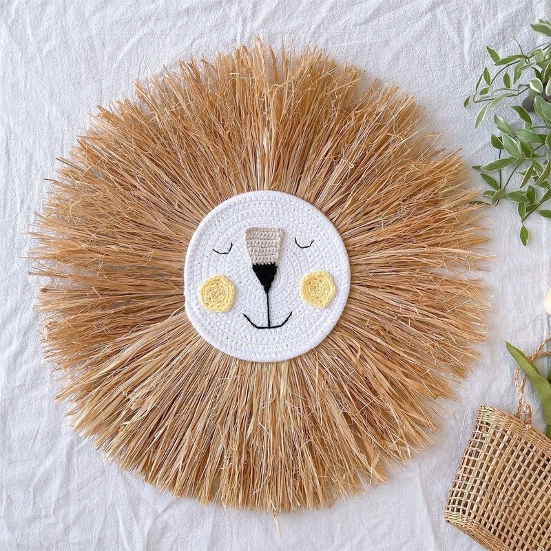 Handmade rattan lion wall art for children's nursery decor. Soft animal art for kids' bedroom.
