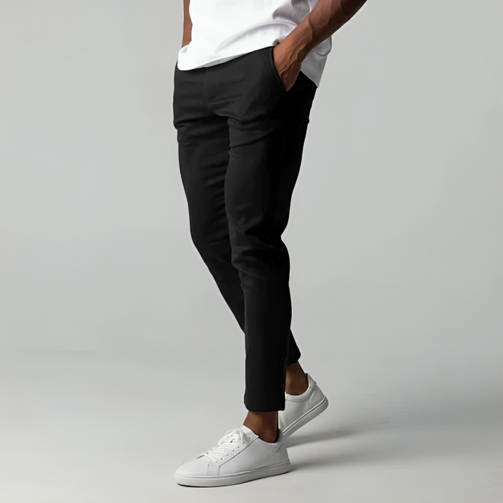 Wrinkle-resistant men's flex chinos, modern slim fit, offering comfort stretch for all-day style.