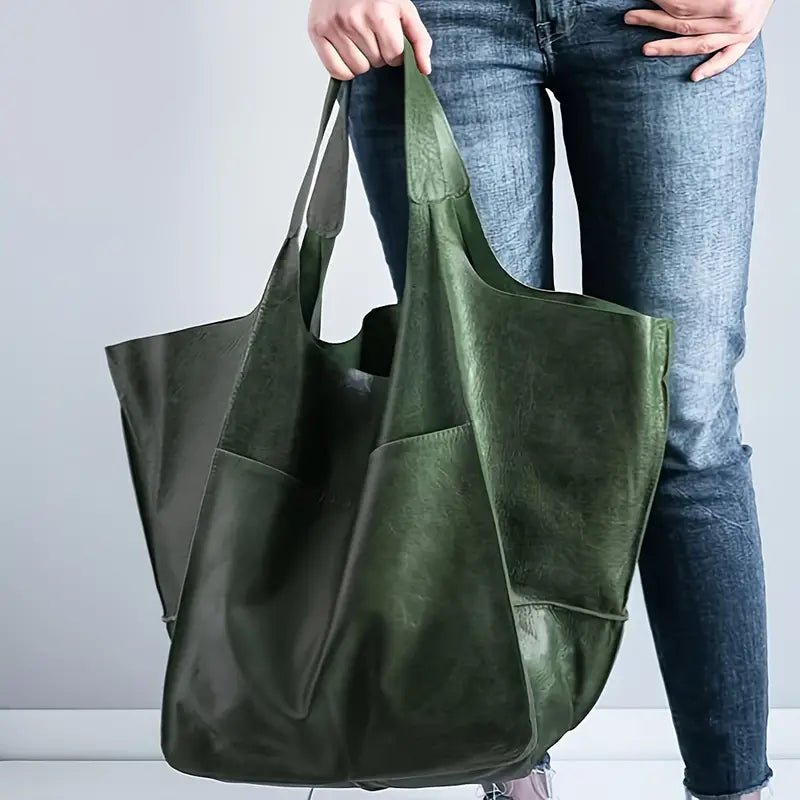 Stylish women's oversized vegan leather tote bag, perfect for everyday use.
