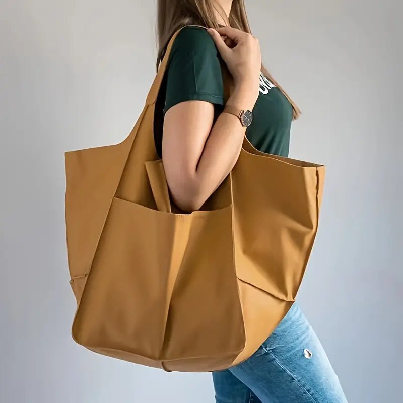 Elegant vegan leather travel tote bag for women, a stylish and large oversized everyday purse.