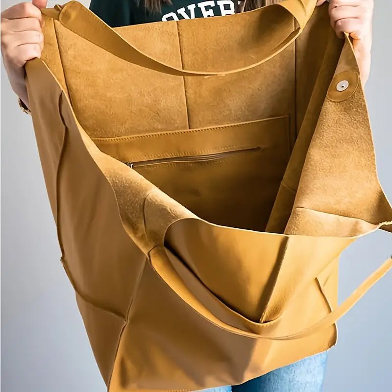 Versatile women's vegan leather oversized tote bag, great for work, travel, or daily essentials.