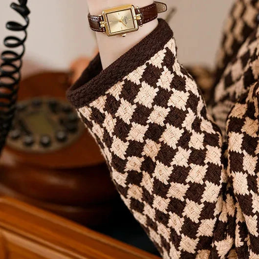 Women's gold-tone quartz watch on wrist, an elegant accessory for daily wear.