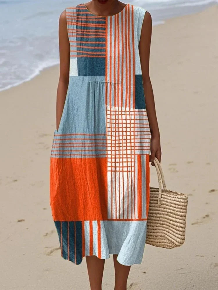 Flowy women's sleeveless midi dress with a vibrant art print. Ideal for summer, casual outings, or office wear.