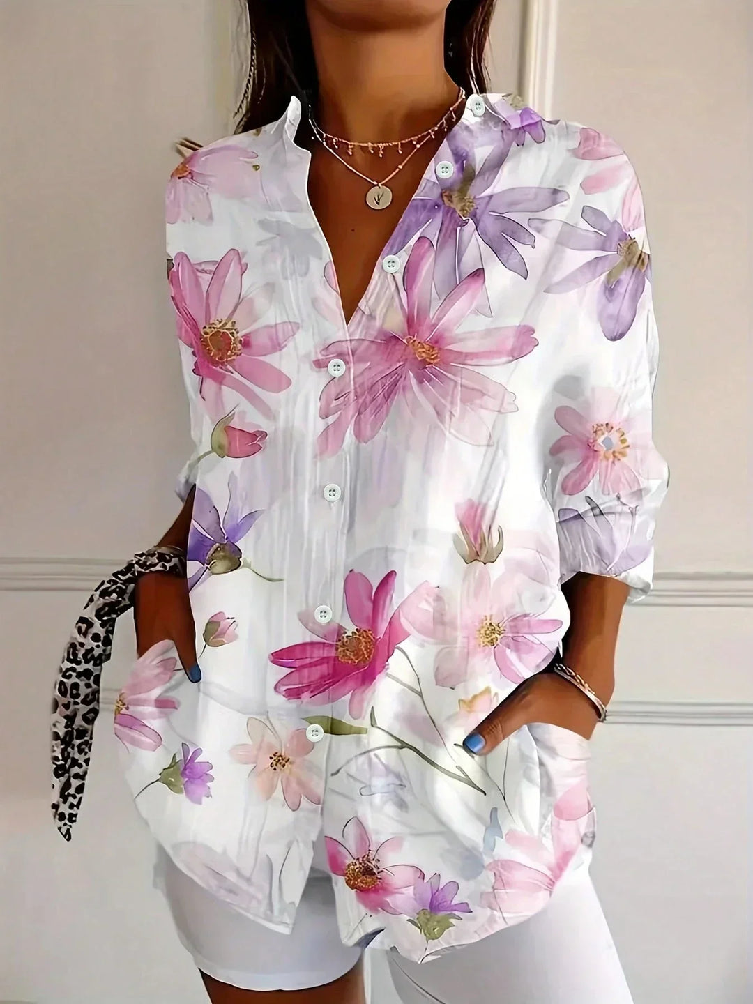 Modern abstract print women's button-front blouse. Long sleeve, relaxed fit casual top for comfortable wear.
