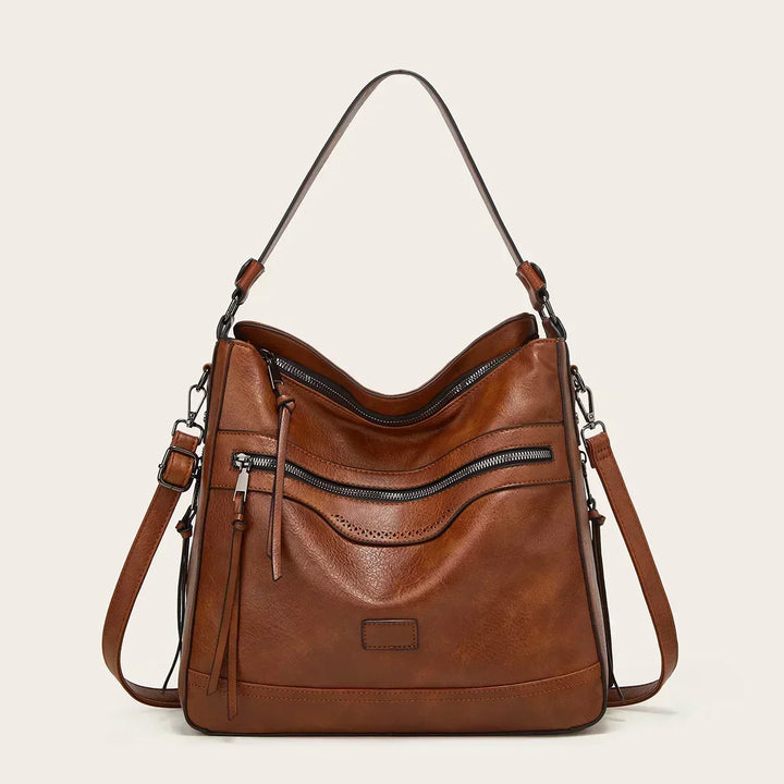 Women's classic vintage brown leather shoulder bag, perfect daily handbag or work accessory. Available in black.