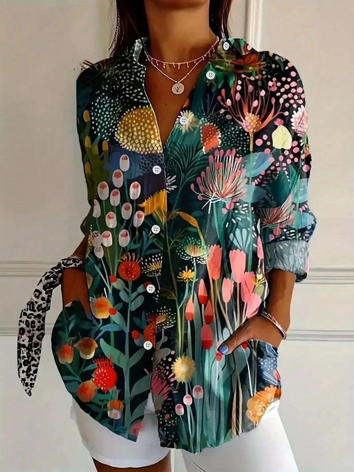 Effortless style: women's collared abstract print blouse. Button-front, long sleeve for stylish everyday wear.