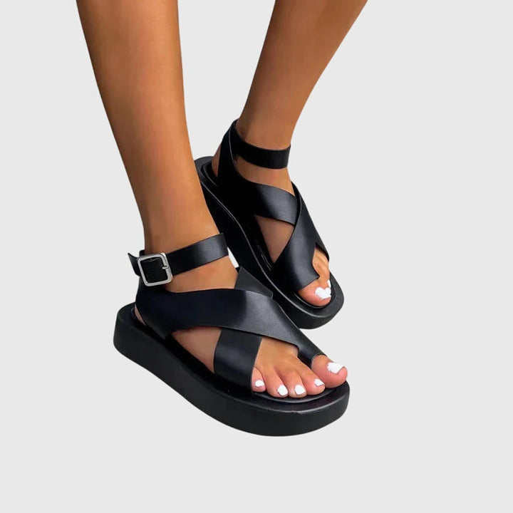 Women's platform gladiator sandals, featuring intricate strappy details and a comfortable sole.