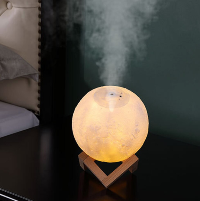 Home air purifier & humidifier with moonlight glow. Improves indoor air quality & adds moisture for comfort.