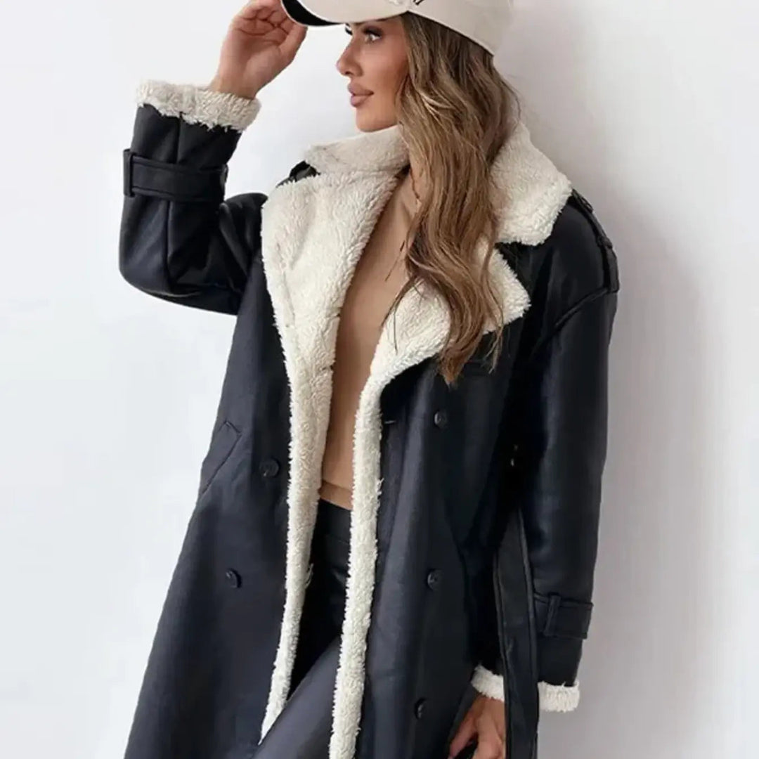 Close-up of a women's long winter coat showing the soft plush teddy collar & warm fabric. Elegant cold weather outerwear.