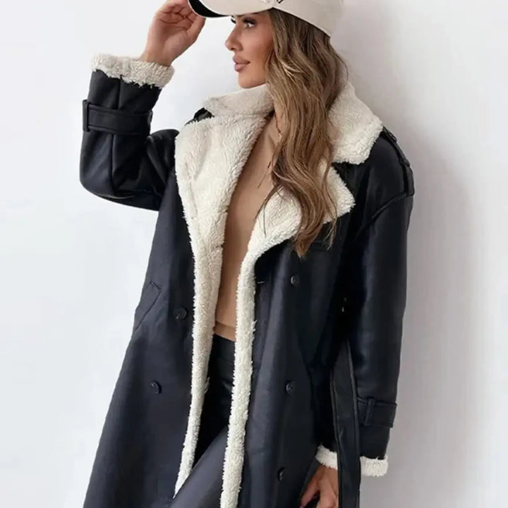 Close-up of a women's long winter coat showing the soft plush teddy collar & warm fabric. Elegant cold weather outerwear.