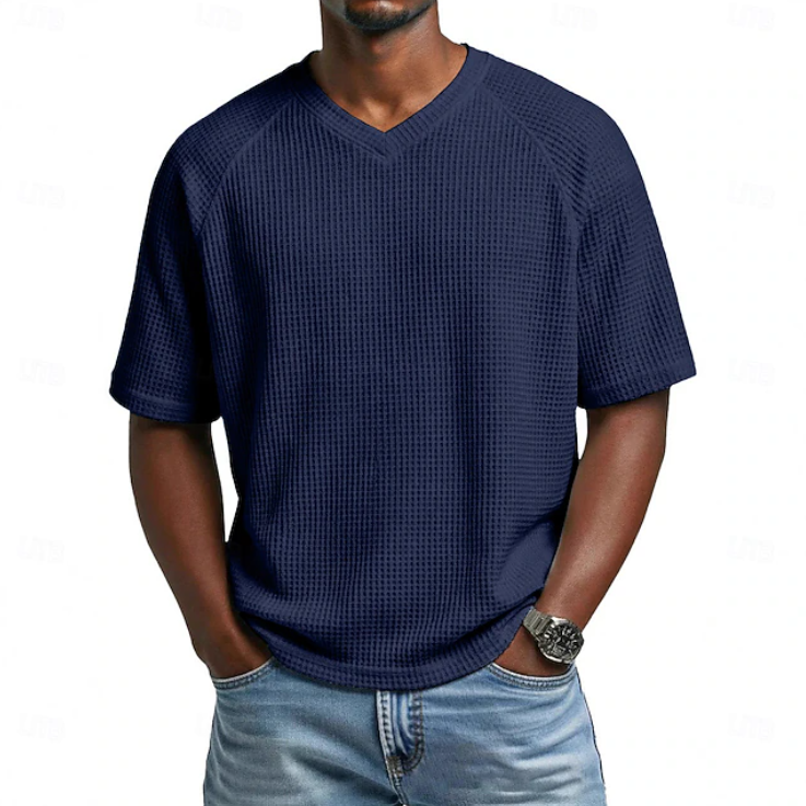 Relaxed fit men's V-neck short sleeve shirt. Comfortable textured top for casual summer and everyday wear.