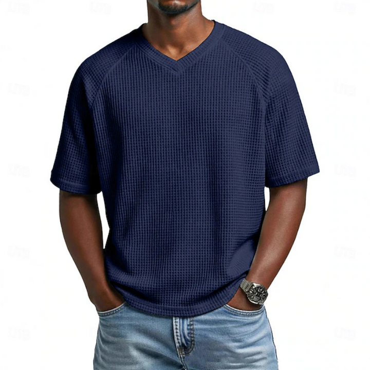 Relaxed fit men's V-neck short sleeve shirt. Comfortable textured top for casual summer and everyday wear.