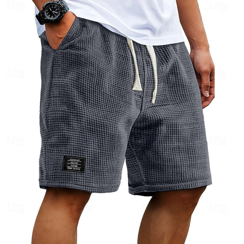 Men's textured casual summer shorts in a light color, perfect for beachwear.