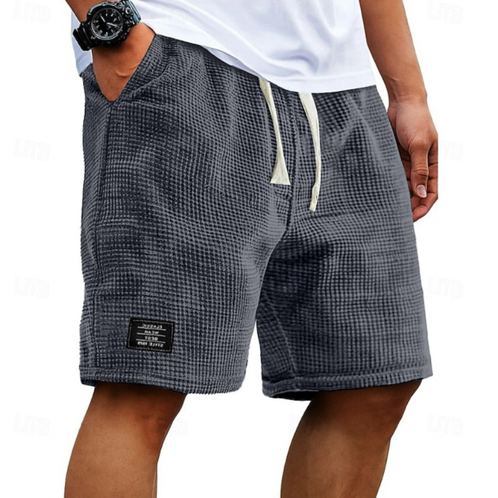 Men's textured casual summer shorts in a light color, perfect for beachwear.