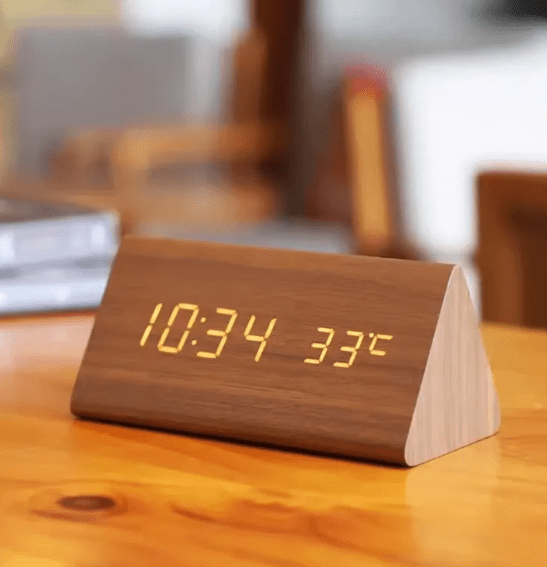 Modern LED digital clock with voice control for desk or nightstand.