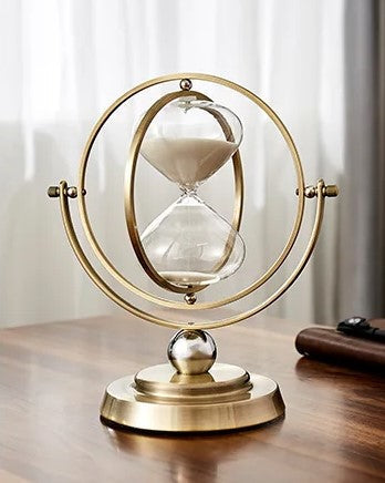 Classic hourglass decor, a beautiful metal frame sand timer for stylish home or office environments.