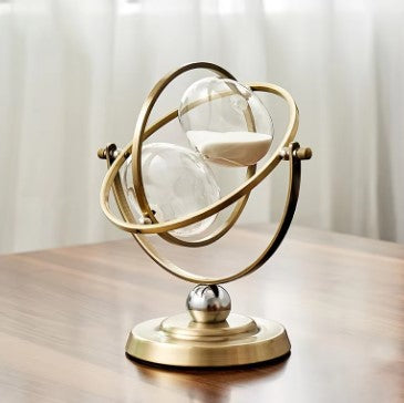 Elegant hourglass sand timer with durable metal frame, perfect office or living room accent.