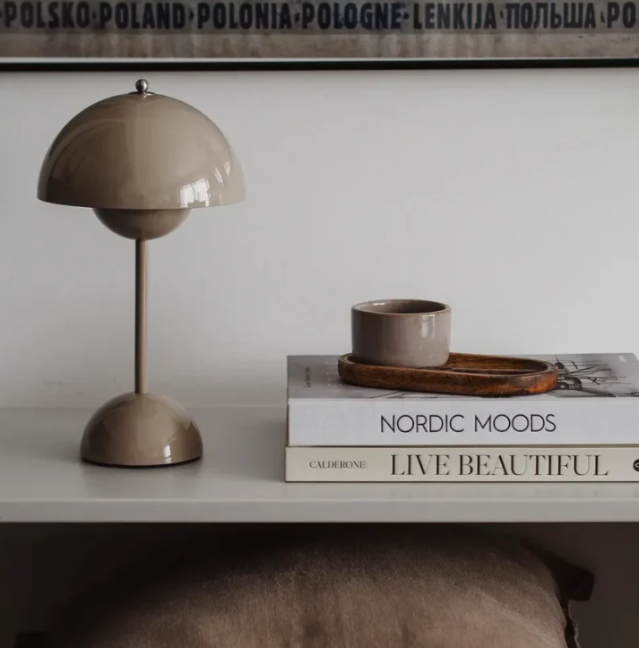 Stylish modern LED desk lamp, touch activated for ambient lighting in home or office.