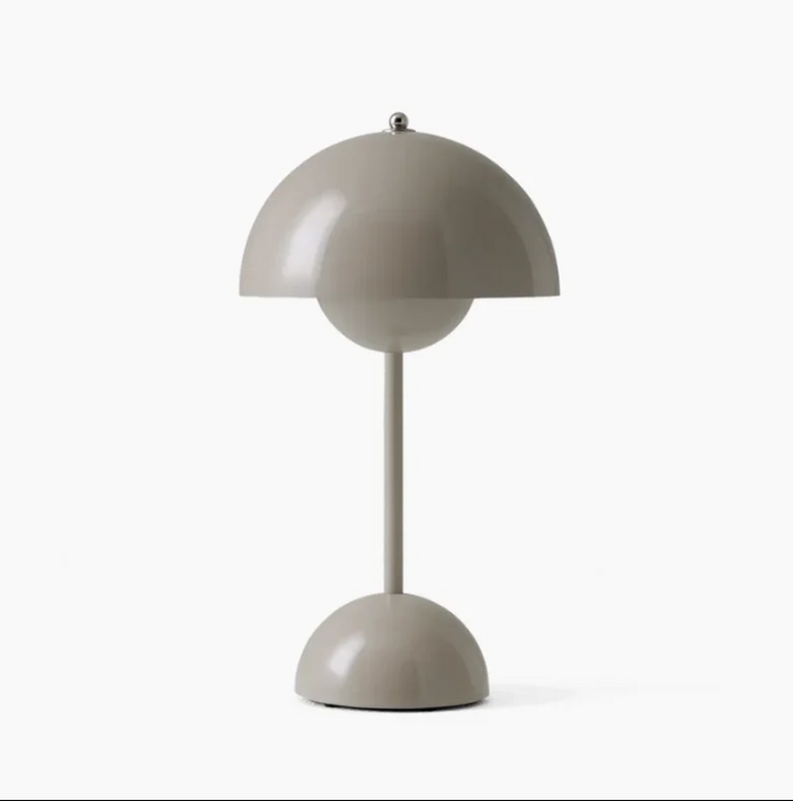 Versatile LED desk lamp with touch controls, enhancing modern living room aesthetics.