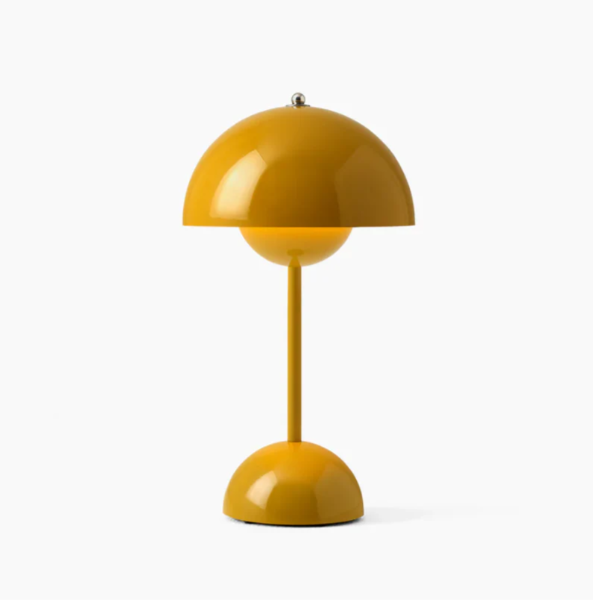 Adjustable brightness modern LED table lamp, touch activated for versatile home lighting.
