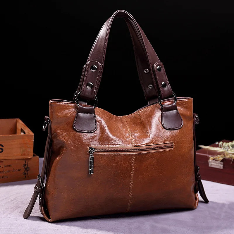 Woman carrying elegant leather crossbody bag. Stylish and practical everyday shoulder bag, fashion accessory for women.