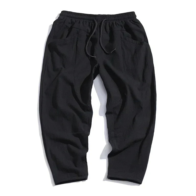 Versatile indigo men's wide leg pants with a relaxed fit, excellent for casual summer and spring fashion.
