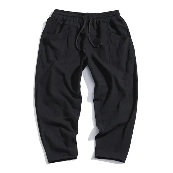 Versatile indigo men's wide leg pants with a relaxed fit, excellent for casual summer and spring fashion.