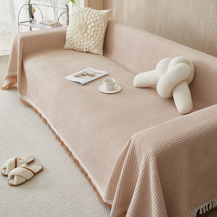 Khaki cotton blend sofa cover, a washable furniture protector & throw blanket for living room or bedroom decor.