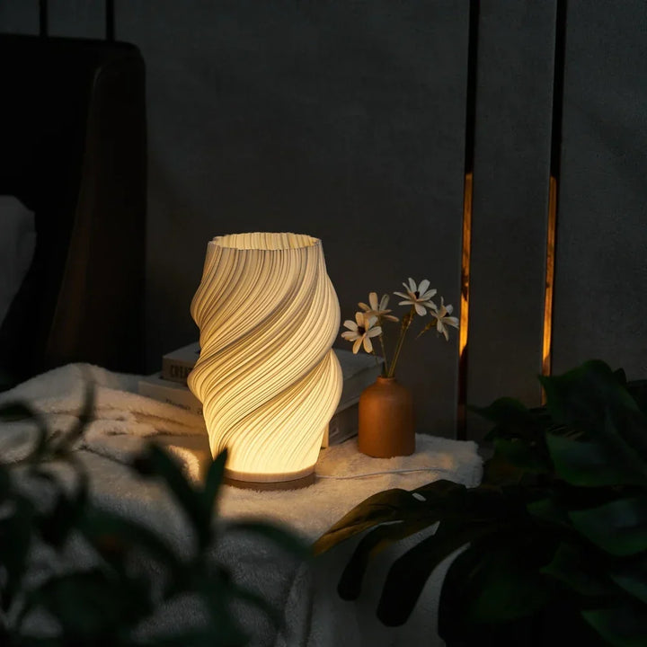 Modern Wavecrest table lamp with dimmable warm ambient light, ideal for living spaces.