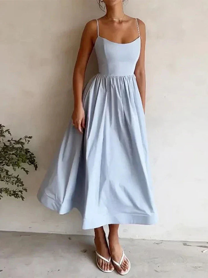 Close-up of elegant scoop neck and thin straps on a women's solid color maxi party dress. Perfect evening wear.