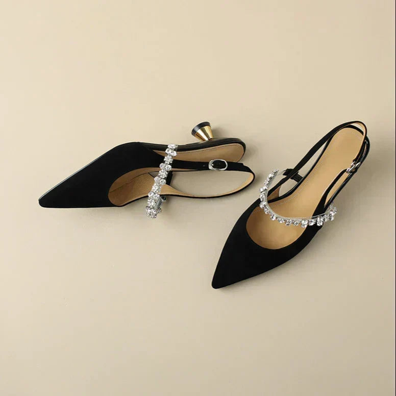 Women's fashionable black crystal slingback pumps, pointed toe, low heel for elegant formal attire.