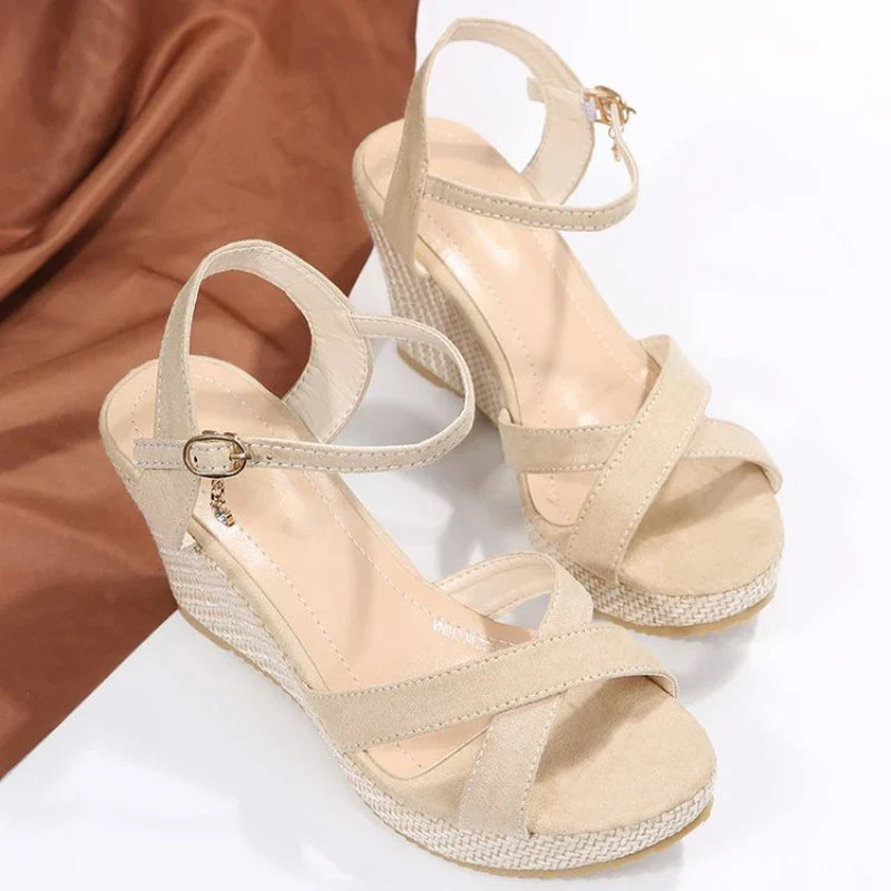 Black women's elegant platform heel sandals with a comfortable ankle strap for all-day wear.