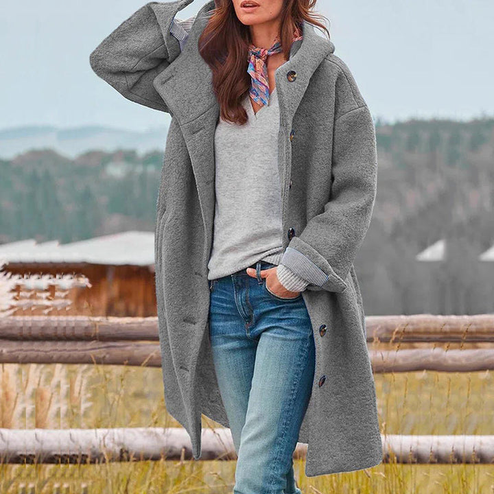 Elegant women's long winter coat in a rich color, perfect for staying warm & stylish in cold weather.