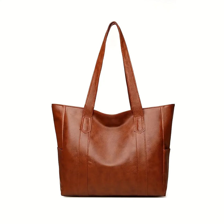 Elegant coffee-colored genuine leather crossbody bag. Women's versatile & durable everyday accessory.