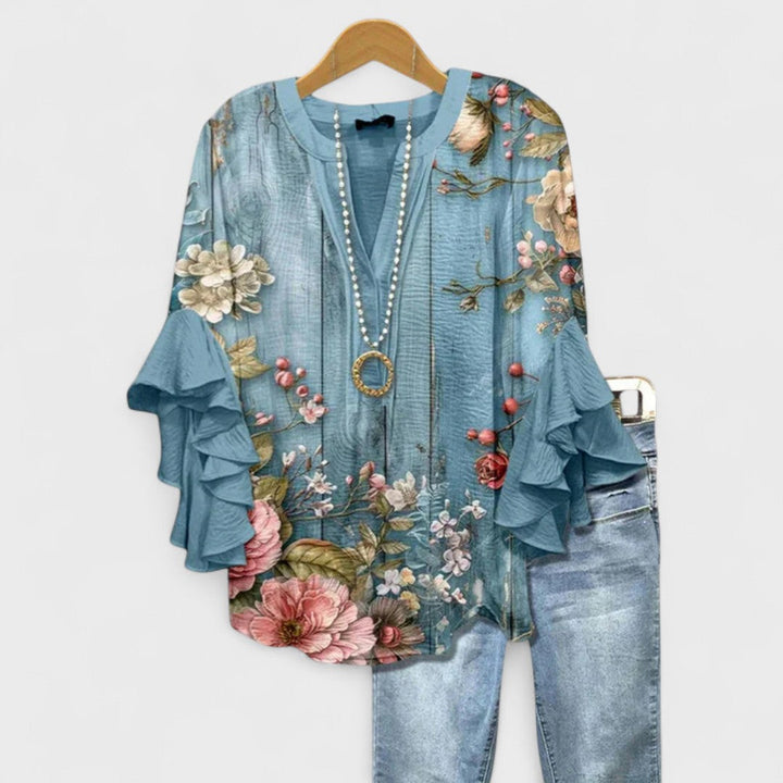 Elegant women's summer blouse with ruffled sleeves, perfect for office or casual chic style.
