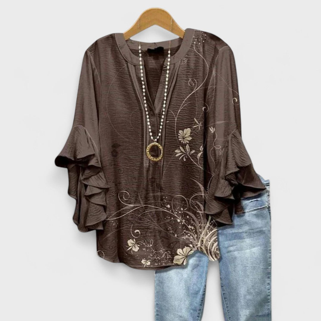 Stylish women's top for summer, featuring chic ruffled sleeves and a flattering silhouette.