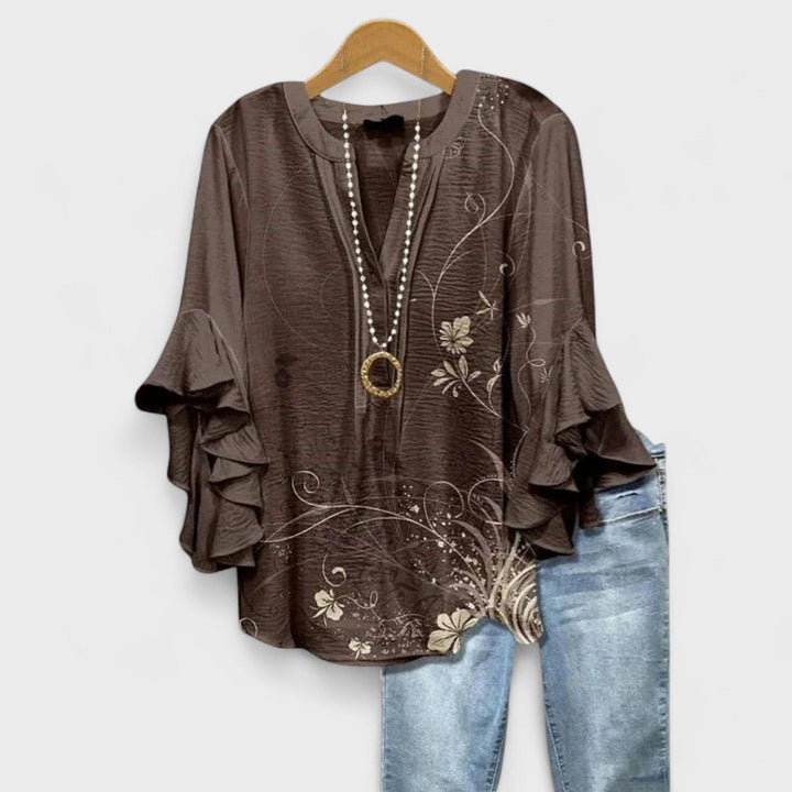 Stylish women's top for summer, featuring chic ruffled sleeves and a flattering silhouette.