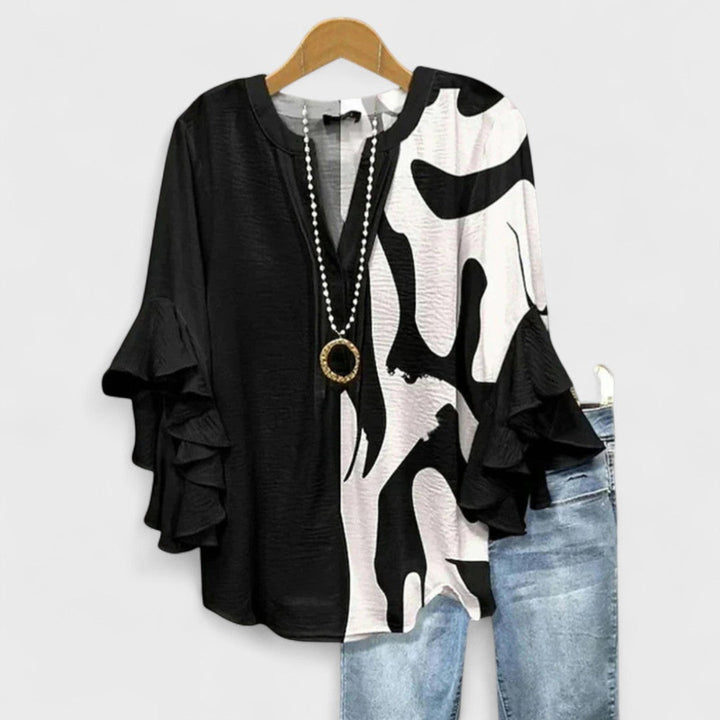 Elegant women's summer blouse with ruffled short sleeves, a perfect blend of comfort & style.