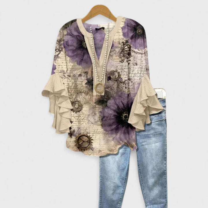 Floral print women's blouse, an elegant summer top with delicate ruffled sleeves for any occasion.