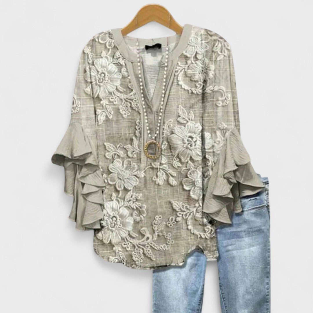 Casual yet chic women's blouse, designed with elegant ruffled sleeves for versatile summer wear.