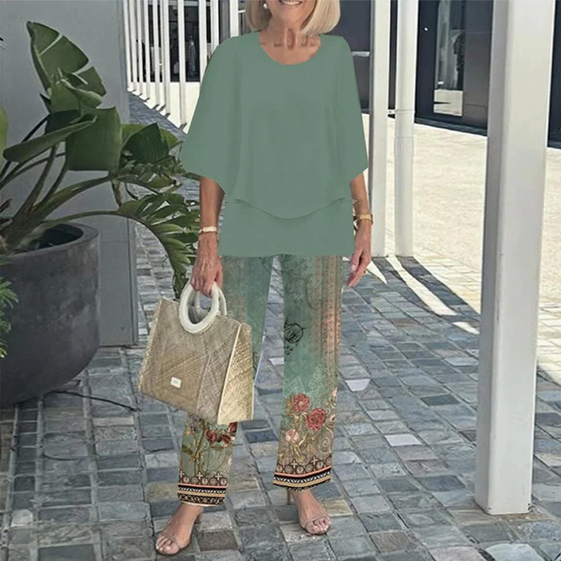 Chic women's matching set: elegant layered top & tropical leaf print pants. Versatile day-to-evening fashion.