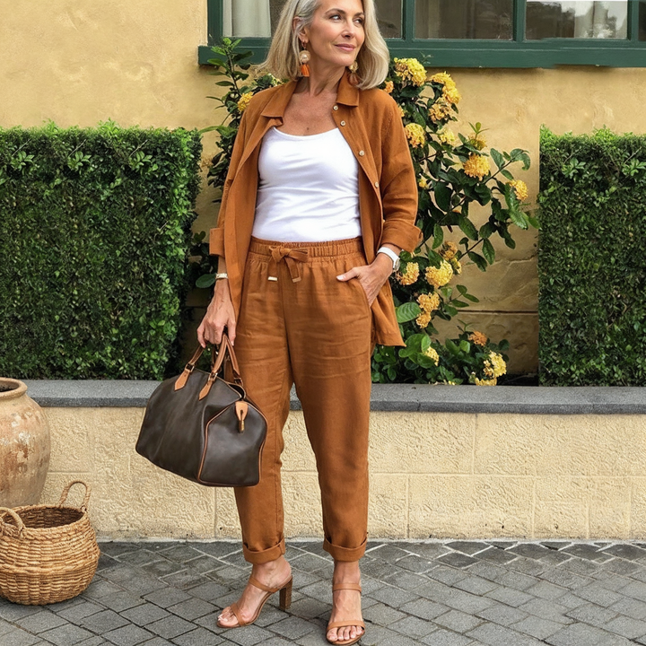Women's casual two-piece lounge set with a button-down top and drawstring pants, ideal for comfort.